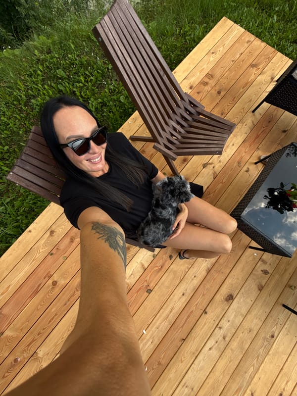 Lazy afternoon on a deck in Chaikovsky with a small gray dog