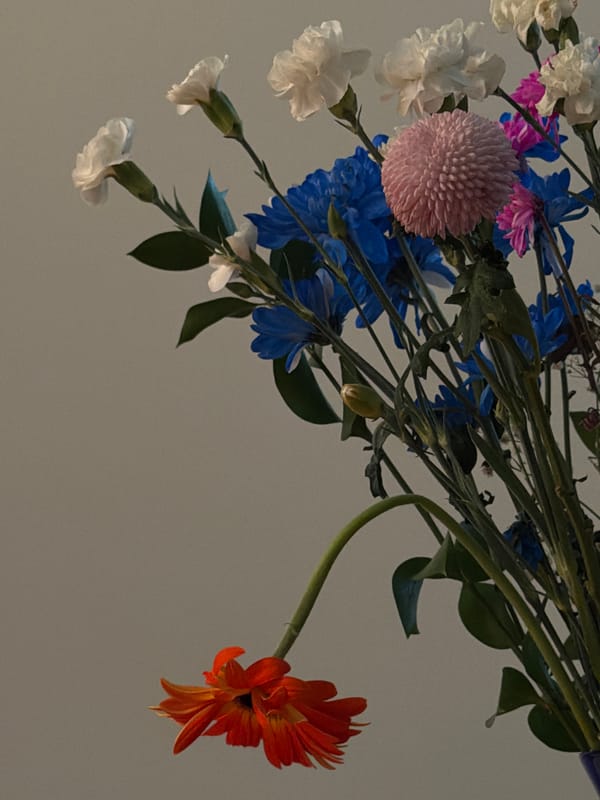 Flowers and palo santo lit by candlelight in Burnaby