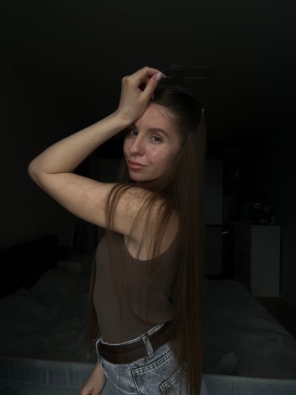 Woman photographed indoors in Klin, Russia apartment setting
