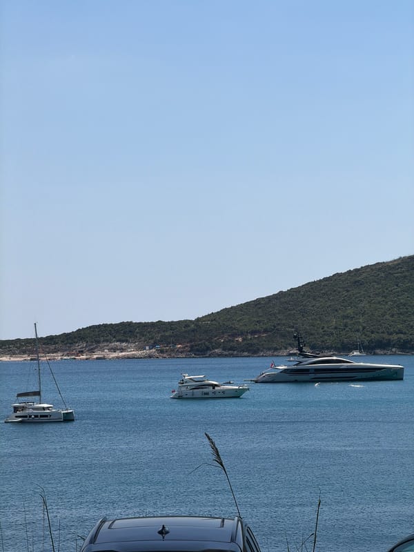 Yachts and calm blue water off the Montenegrin coast