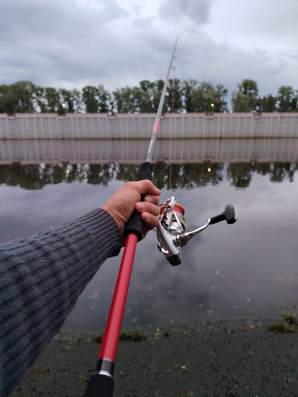 Late-night angler fishes Kama River in Chaikovsky, Russia