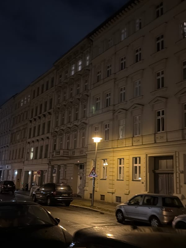 Berlin streets after dark, ornate facades and city movement