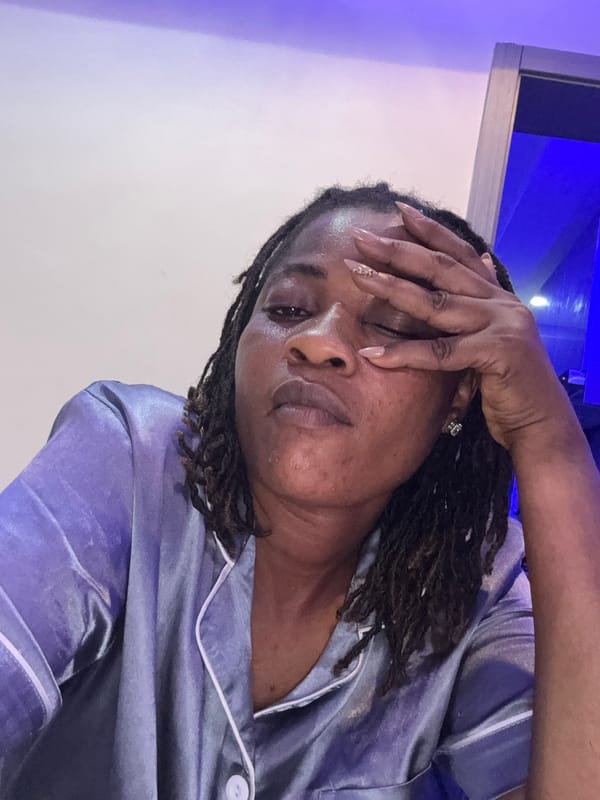 Late-evening selfie session in Ajara, Nigeria, in satin pajamas