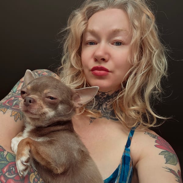 Woman holds chihuahua in Saint Petersburg morning scene