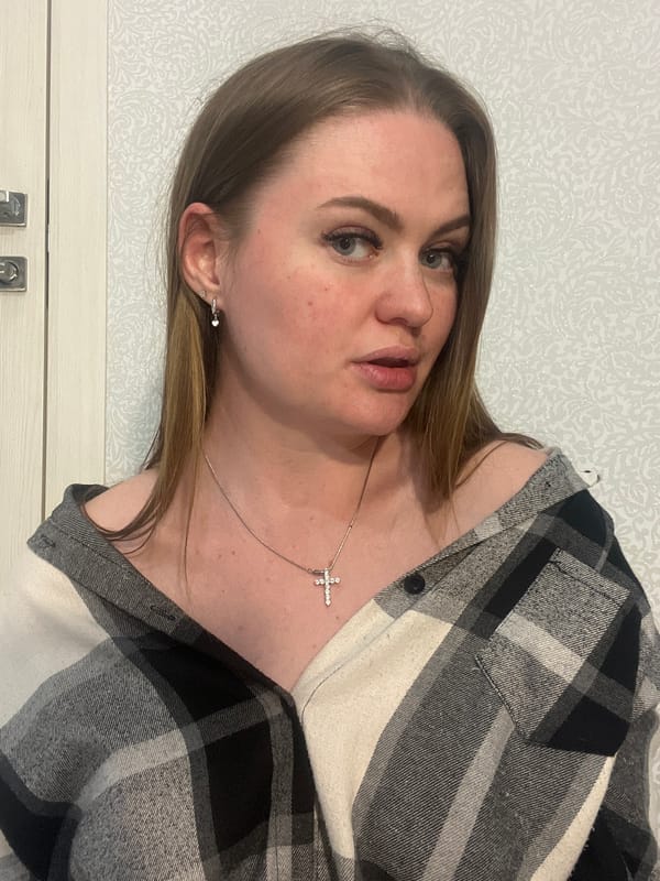 Woman in checkered shirt observed indoors in Sevastopol