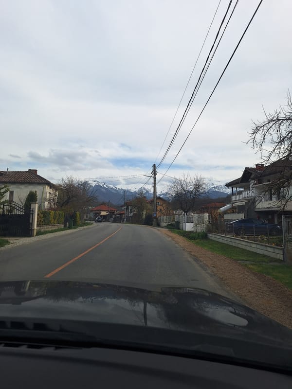 Residential street documented in Apriltsi, Bulgaria with mountain views