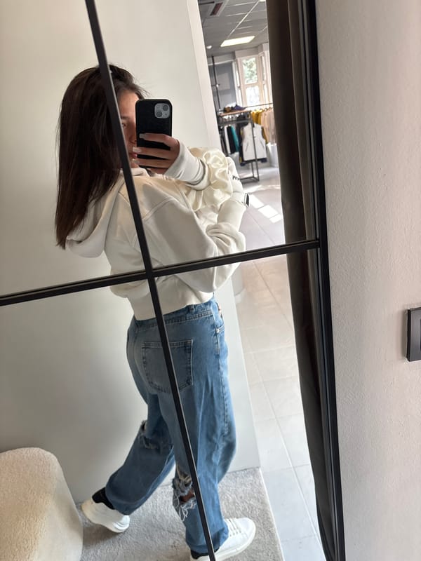 Woman takes mirror selfie in Gabrovo retail location