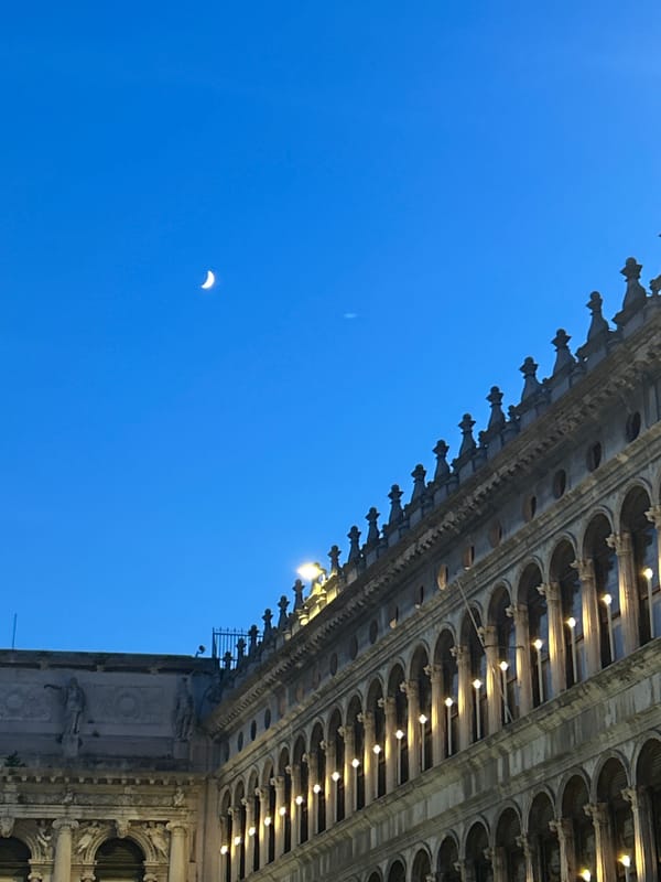 Venice's Bridge of Sighs and crescent moon at twilight
