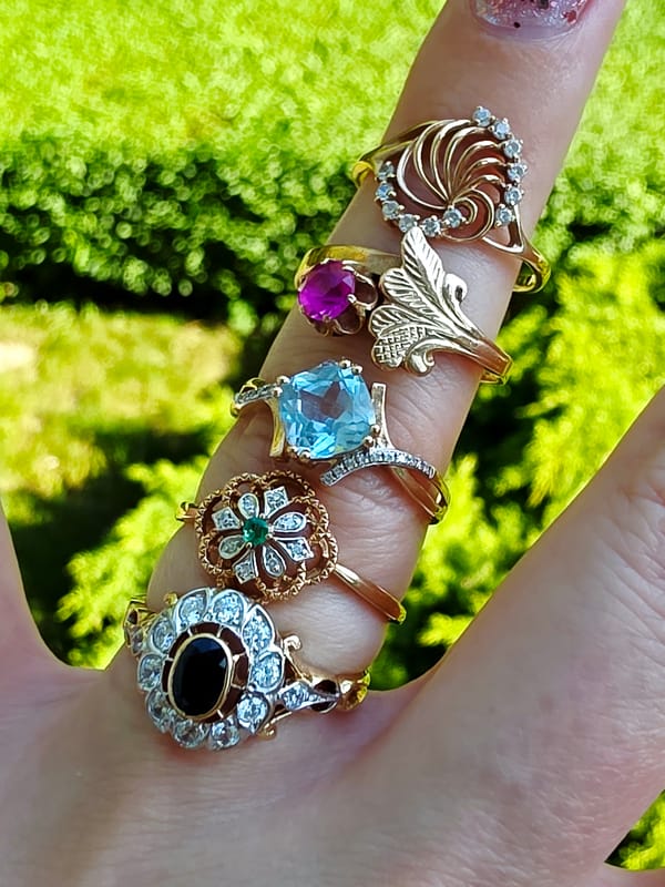 Rings and Chanel perfume styled across a short shoot