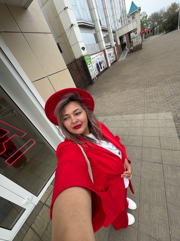 Woman in red outfit photographed with balloons in Birobidzhan