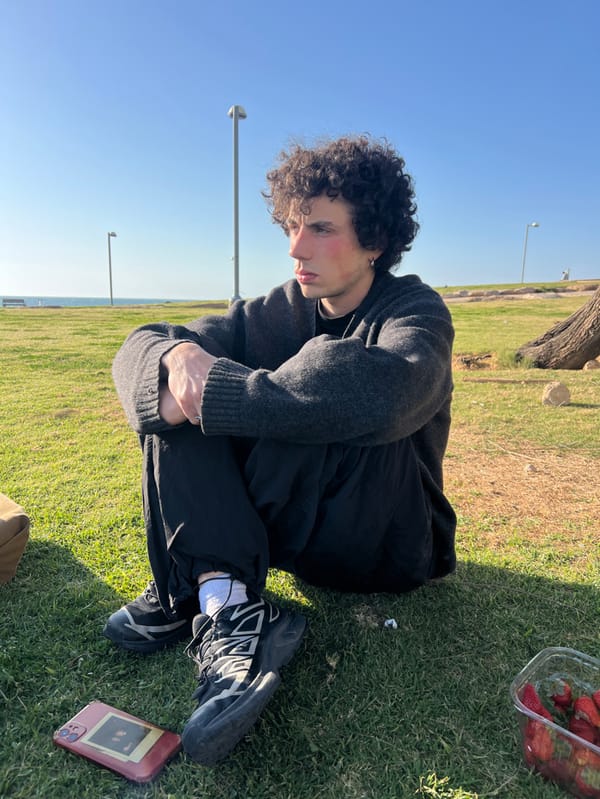 Young person enjoys leisurely afternoon in Tel Aviv coastal park