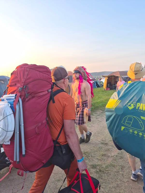 Costumed festival crowd camps out at sunset in Lagunovo