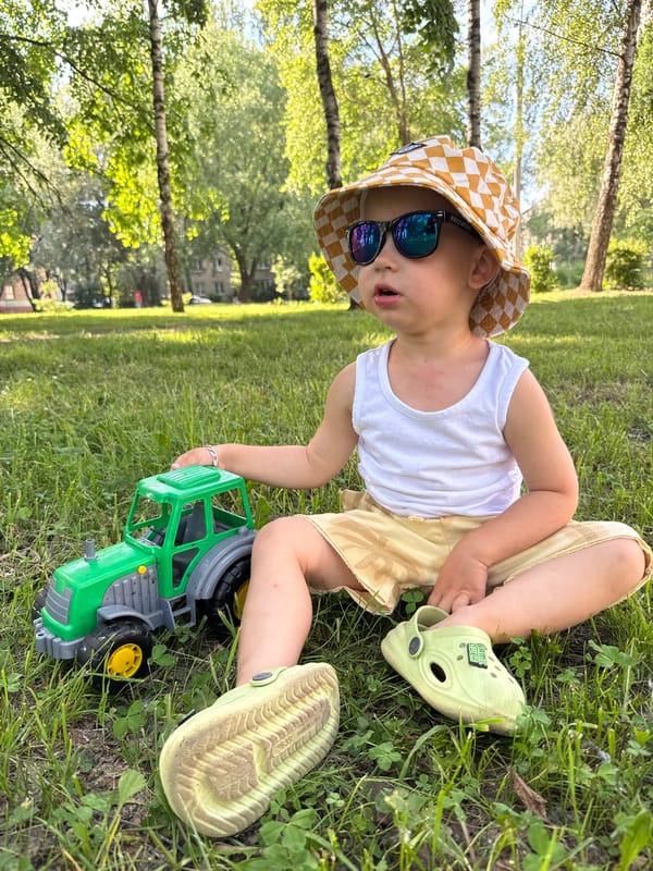 Family enjoys sunny afternoon at Rusanovo park with toys