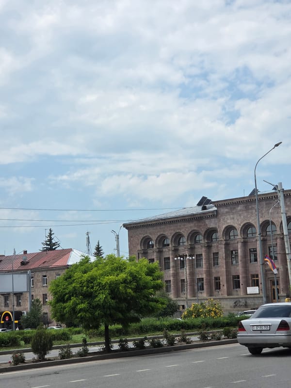 Street activity around a monument in Gyumri, Armenia