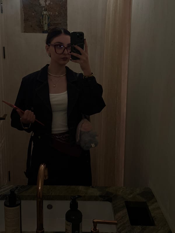 Woman takes selfies at Yerevan restaurant during evening visit