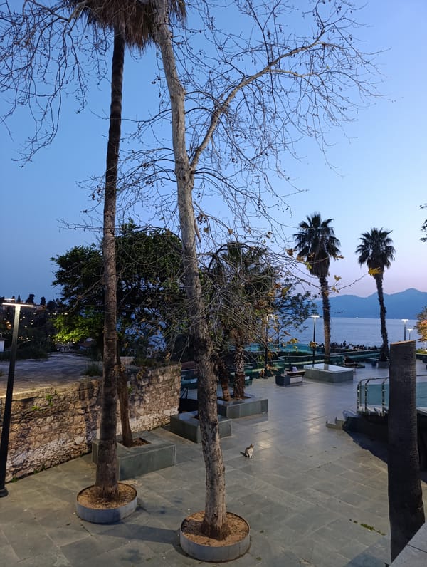 Tourist documents evening stroll through historic Antalya district