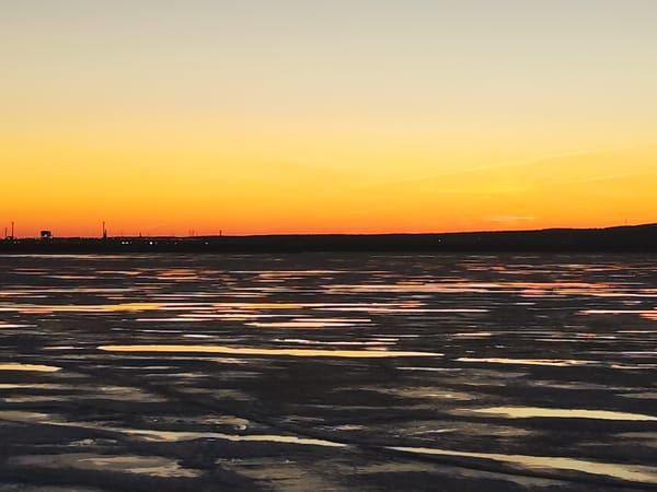 Sunset observed over water in Chaikovsky, Russia