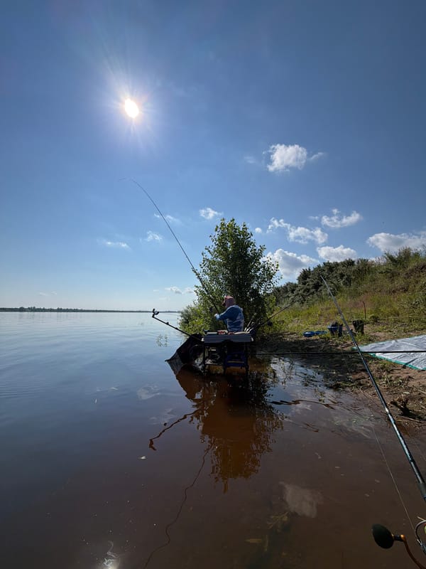 Riverside fishing session near Tarasovo on a calm summer morning