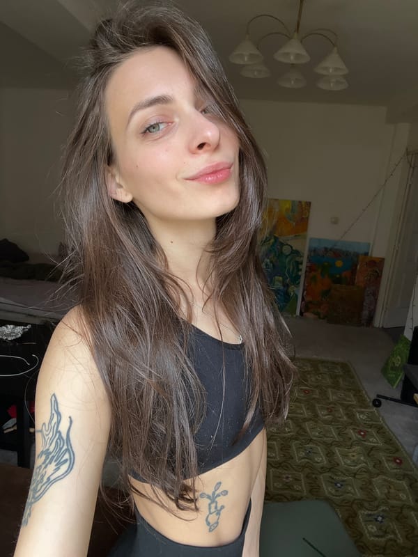 Woman in black athletic wear observed indoors in Krasnoyarsk