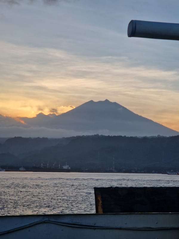 Ferry passengers witness sunset mountain views near Ketapang, Indonesia