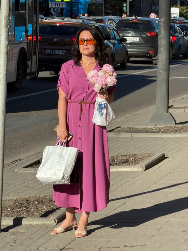 Summer morning foot traffic on Krasnoyarsk's city sidewalks