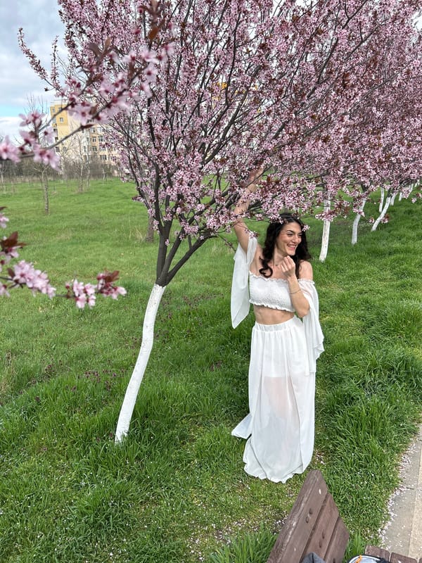 Woman rests near flowering tree in Plovdiv park