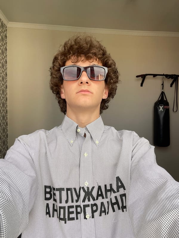 Person dances in Krasnoyarsk wearing underground-themed Cyrillic shirt