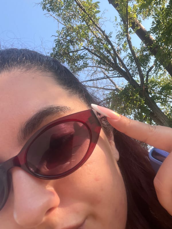Close-up selfie detail: sunglasses and eye, Varna summer.