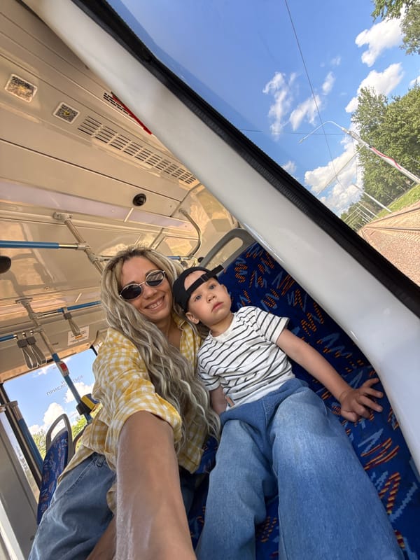 Mother and child ride bus in Rusanovo, Russia