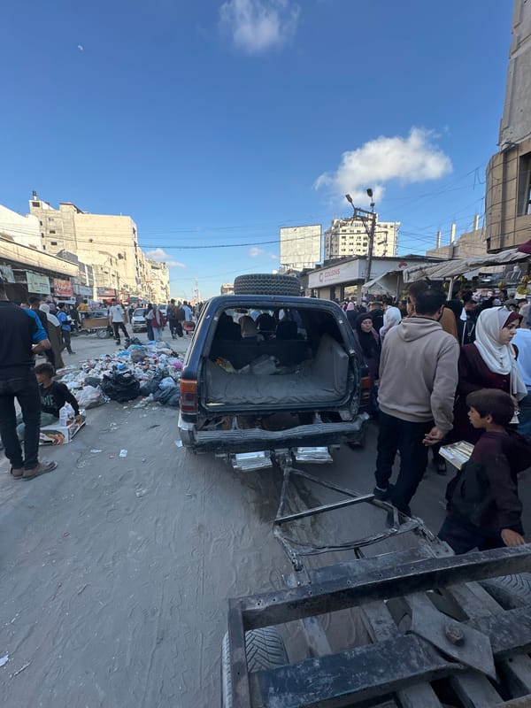 Gaza street markets bustling despite urban damage, families sheltering
