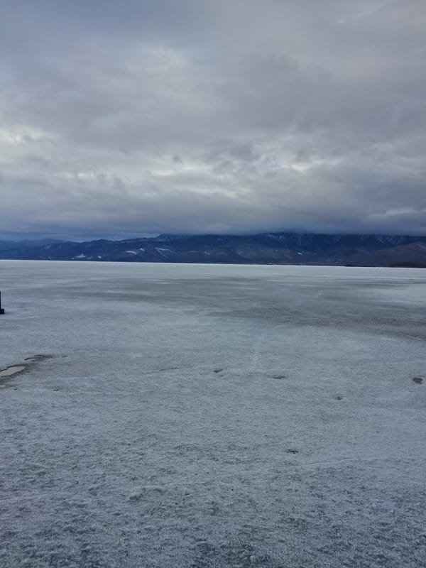 Cloudy skies observed over icy Kultuk landscape, Russia