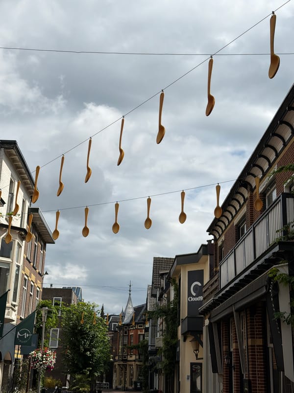 Giant wooden spoons hang over an Apeldoorn street in quirky installation