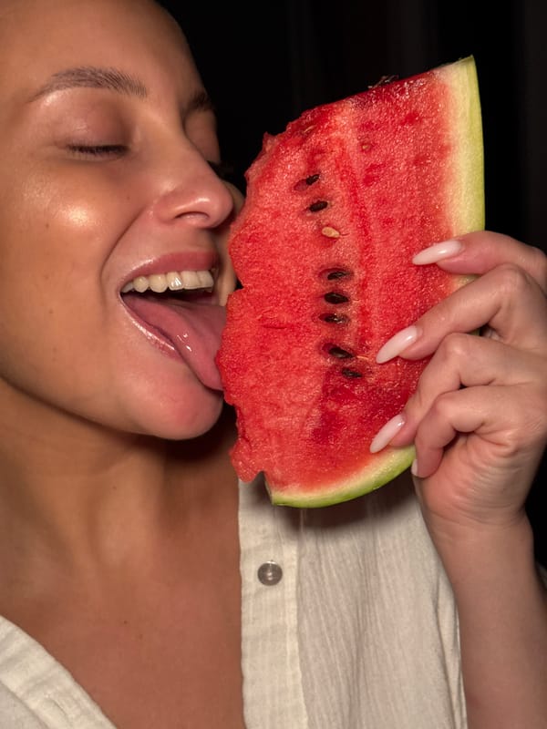 Person enjoys watermelon while resting in Chaikovsky, Russia