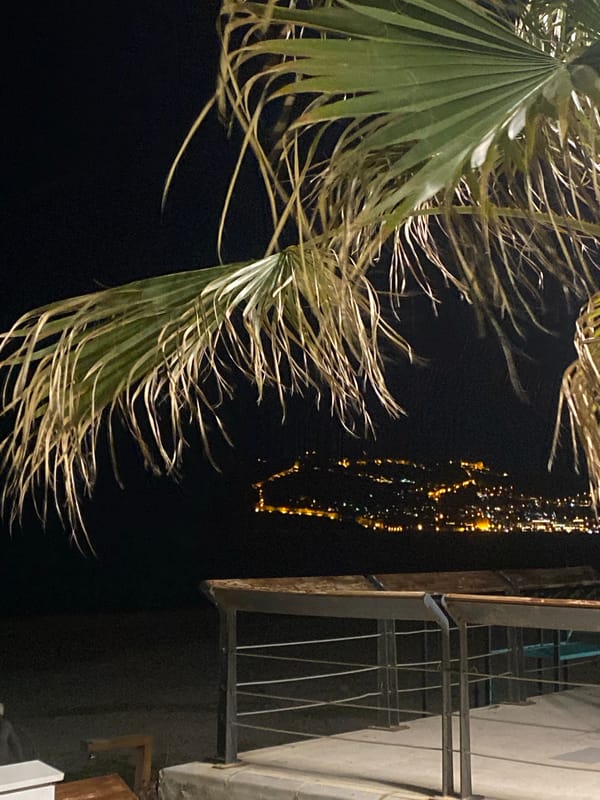 Evening stroll documented along Alanya's illuminated seaside promenade