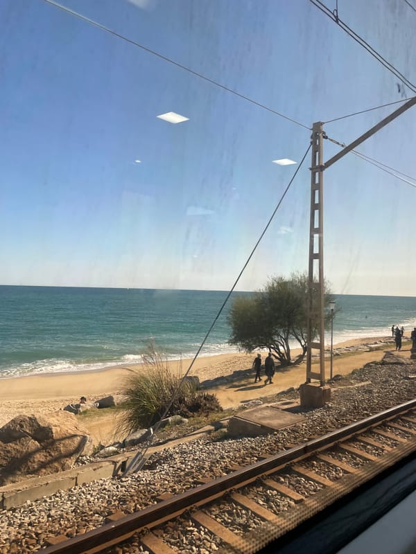 Train passenger views Mediterranean coast near Sant Andreu de Llavaneres
