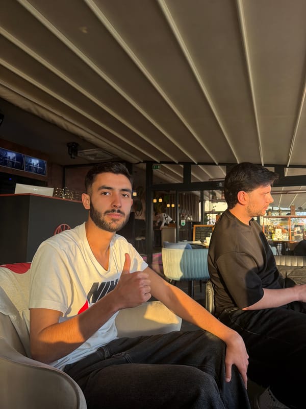 Men gather at Rijeka café, casual social moment captured