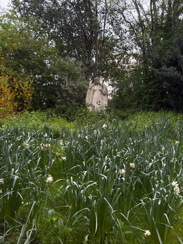 Stone sculpture spotted in Paris garden setting