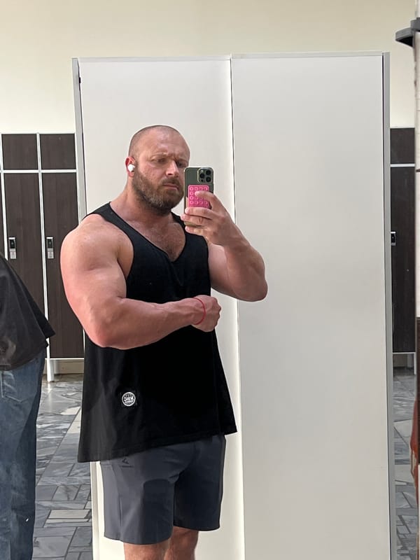 Post-workout mirror selfies in a Chaikovsky gym locker room