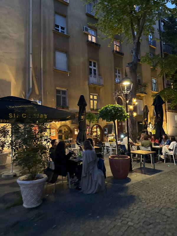 Evening street life captured in Belgrade's cobblestone district