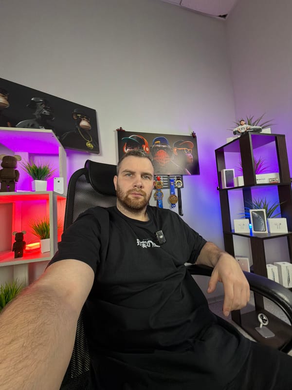 Man Takes Selfies in Professional Studio Setting