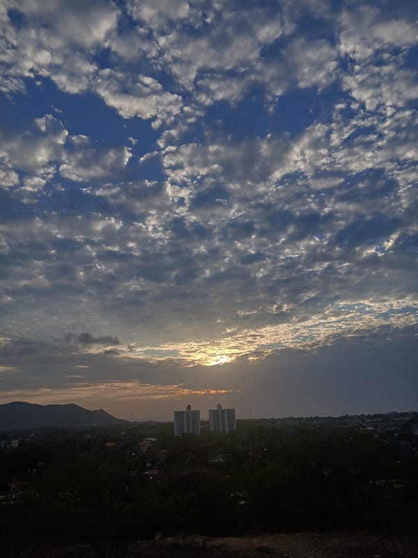 Sunset documented across Juan Griego cityscape, Venezuela