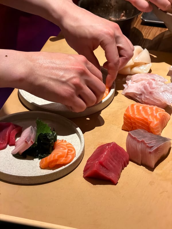 Moscow sushi chefs prepare fresh sashimi during afternoon service