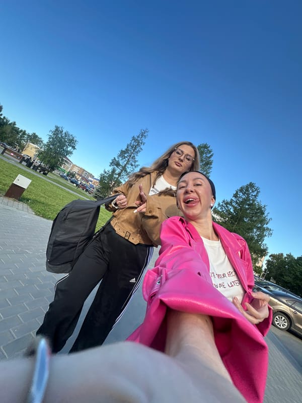 Young women pose for selfies at Izhevsk train station