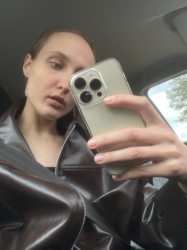 Person takes selfie, holds sunflower seeds in Sharkan vehicle