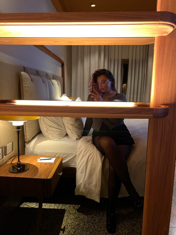 Young woman documents evening with selfies in Tel Aviv accommodation