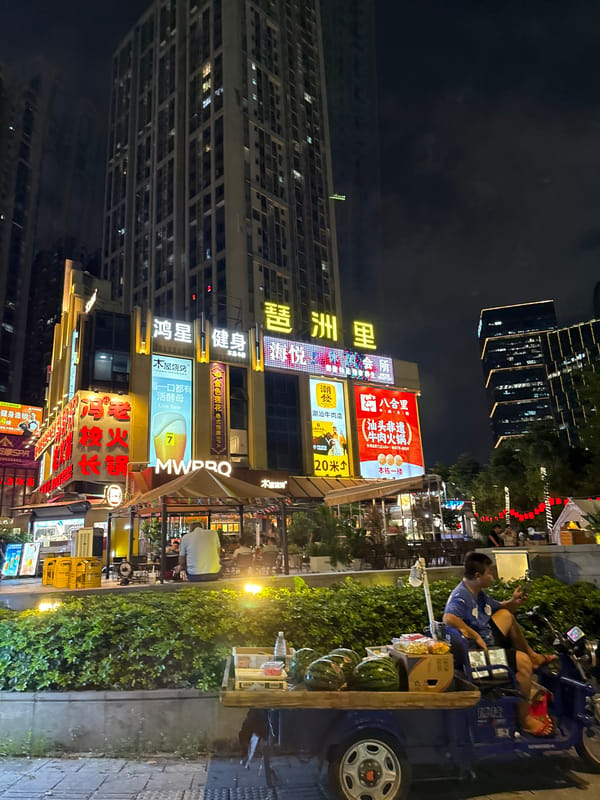 Haizhu District streets alive at midnight, neon and traffic