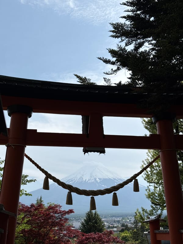 Mount Fuji photographed through torii gate in Fujiyoshida