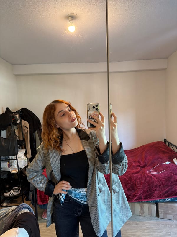 Woman takes mirror selfies in Strasbourg bedroom