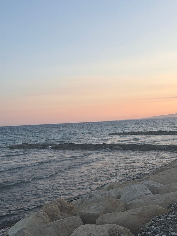 Sunset selfies and seascapes on a Pervolia pebble beach