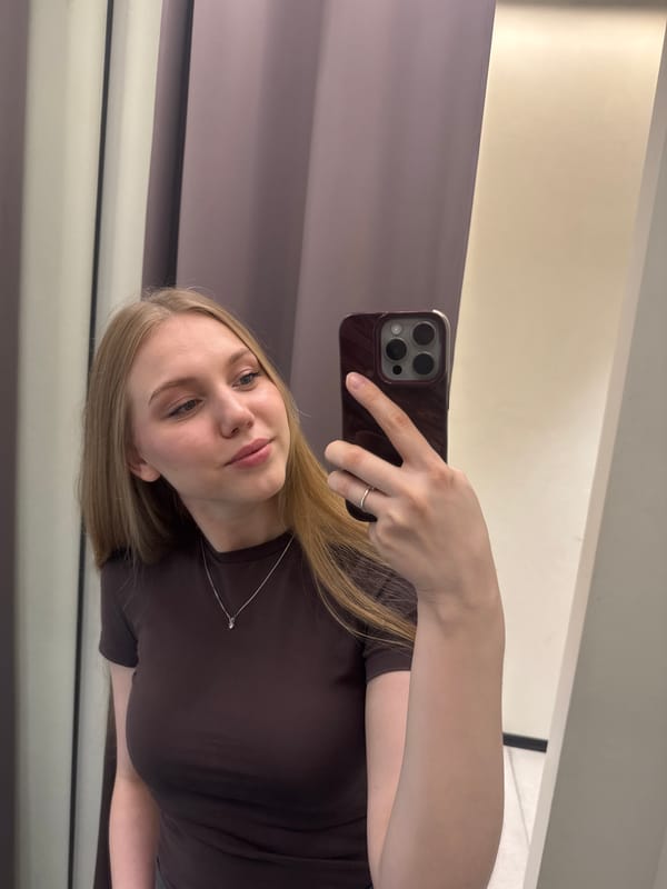 Young woman documents shopping trip through Perm, Russia stores